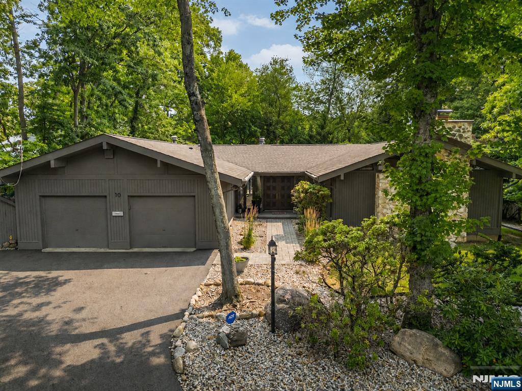 Welcome to your own private staycation retreat at 10 Reed Ct, where luxury, comfort and resort style living come together on a beautiful half acre in one of Wayneâ€™s most desirable neighborhoods. This exceptional ranch style home offers 3,025 sf of thoughtfully designed living space plus a finished lower level. The home features five bedrooms, one currently used as an office, along with four recently remodeled bathrooms. At the heart of the home is a stunning, newly renovated gourmet kitchen featuring high-end appliances, two islands & an open flow thatâ€™s perfect for everyday living & entertaining. Spacious sun-filled rooms, thoughtful updates & quality craftsmanship provide the perfect balance of elegance & functionality. Adding warmth & charm are two wood-burning fireplaces, perfect for cozy evenings. The finished walk-out lower level offers exceptional flexibility with a large recreation room and additional living space ideal for guests, a home office, gym, or media room. Step outside and discover your own backyard oasis. The heated Gunite pool with spa, Trex deck, expansive patio, & lush, private yard create an incredible setting for entertaining or simply relaxing in complete privacy. Located on a quiet cul-de-sac in the highly desirable Wayne Hills section, youâ€™ll enjoy a neighborhood setting while being close to top-rated schools, shopping, & major transportation. 10 Reed Ct is truly a rare opportunity to own a home where every day feels like a resort getaway.