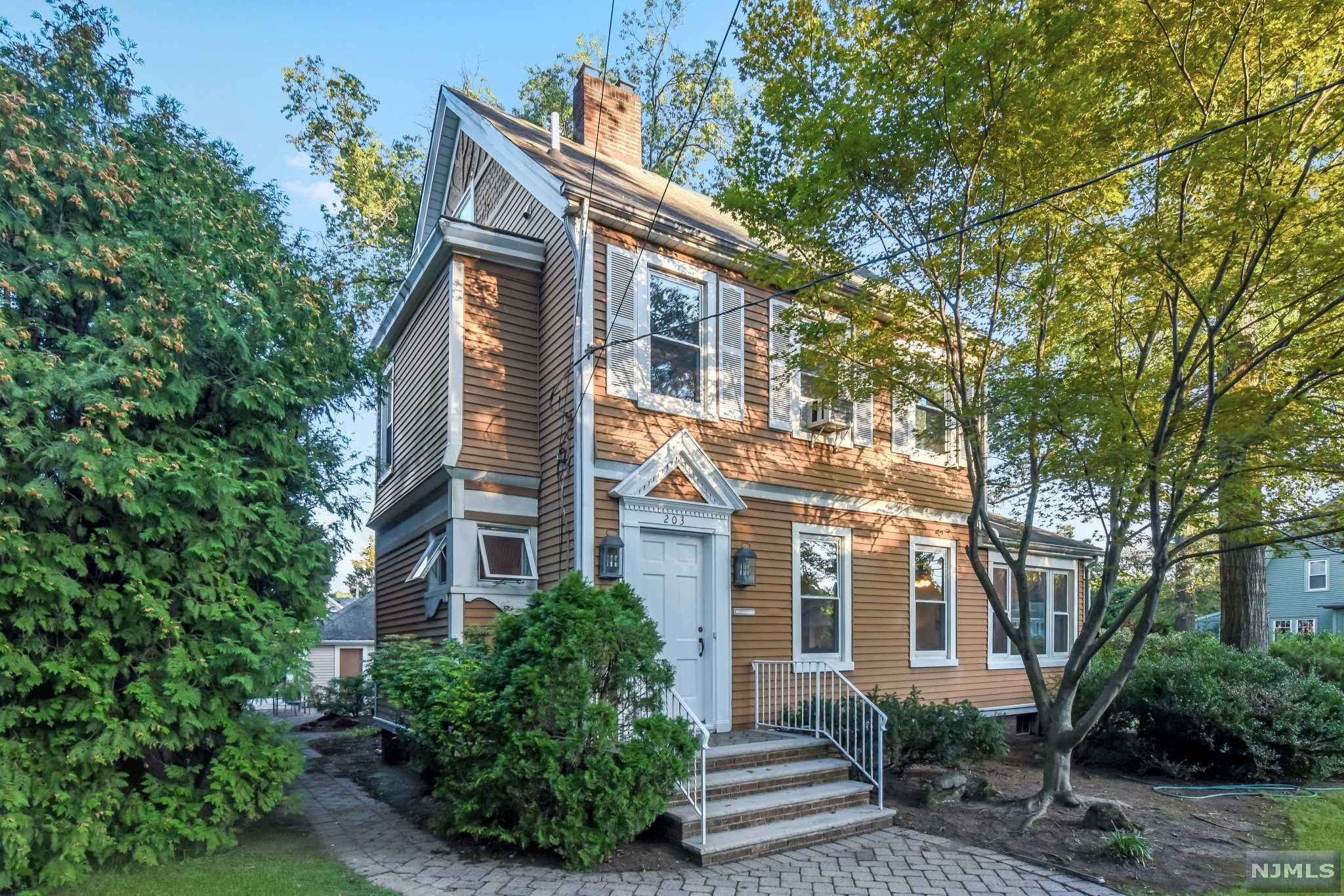 In-town location! Charming 4 bedroom, 2.5 bathroom colonial situated in the heart of Ridgewood close to shopping, dining, and NYC Transportation. This freshly painted, 2004 renovated home is bright and open with spacious rooms, and beautiful hardwood floors. Spectacular flow on first level - entry foyer leads to a flexible floor plan between the living room with fire place, den, and spacious dining/family room area. At the back of the home, find an eat-in kitchen with granite countertops, entrance from backyard patio, and the powder room. Second-level features a master bedroom with master bathroom and large walk-in closet, two additional generously sized bedrooms, and plenty of closet space. Trendy spiral staircase leads to a massive 3rd floor bedroom with skylights. Large unfinished basement with high ceilings offers great potential for an additional living space. 2-car detached garage, backyard with patio, low taxes for Ridgewood!