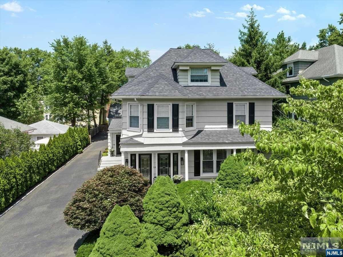 Imagine a charming, fully renovated two-family home located in Ridgewood, just a short stroll from the train station and the vibrant center of town. The home showcases a blend of classic and modern design, gardens beautifully landscaped w/flower beds, & lush greenery. As you step into the first unit, you're greeted by a spacious living room w fireplace, a dining room with large windows that flood the space with natural light, 3 bedrooms, hardwood floors, 2 fireplaces, recessed lighting, a neutral color palette that creates a warm and inviting atmosphere. The adjacent open-concept kitchen boasts modern stainless steel appliances, quartz countertops, & center island. The primary bedroom is complete w/walk-in closet, a bathroom w/ high end finishes and full glass walk in shower. The second unit mirrors the elegance of the first with 3 bedrooms 2 full baths, kitchen, dining room spread on 2 floors. The primary bedroom offers a large walk-in closet, all w/privacy and sep entrance.