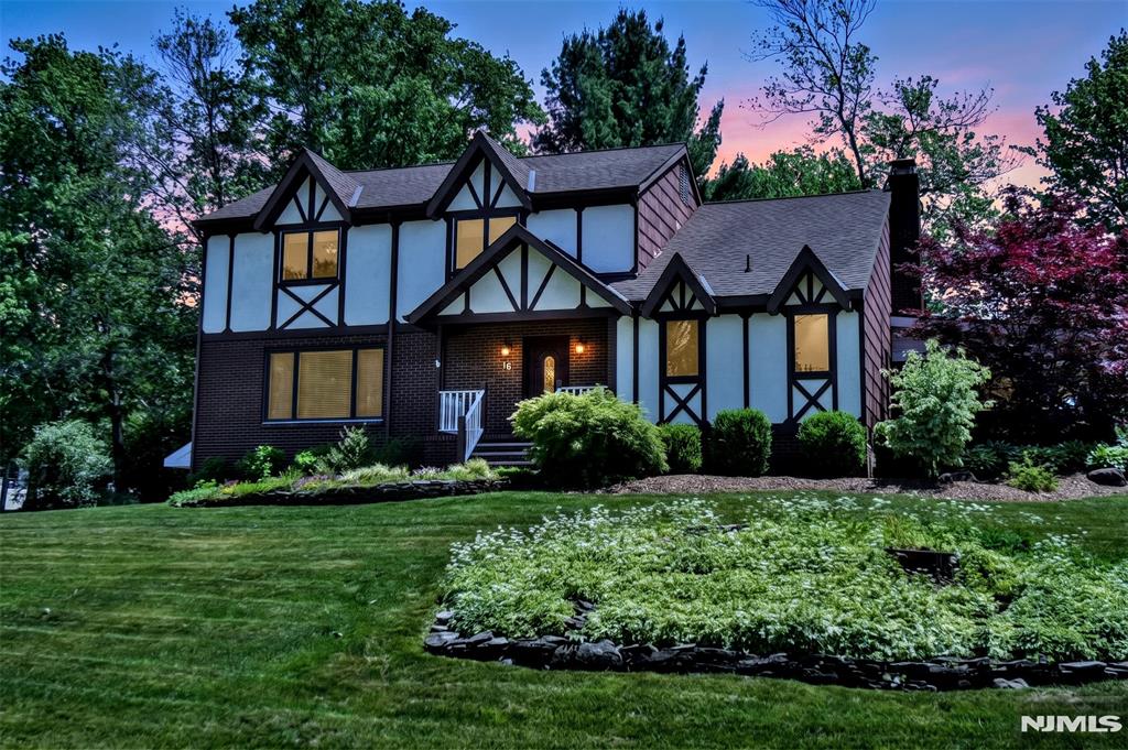 If you love to entertain this Tudor style center hall colonial is for you! Situated on a corner lot, as you enter the foyer to your left are glass French doors leading to a formal living room and a formal dining room, with large windows to let in the light. To your right is a Combined Craft-Office-Laundry-Pantry. The family room with wainscoting a wood-burning brick fireplace, beamed ceiling, and hickory flooring are just a step away. That leads into the beautiful custom kitchen with plenty of cherry cabinets stained ebony with chocolate glaze, granite countertops and a large center island with plenty of drawers. some of the cabinets have glass doors and shelving as well as lighting inside. All Thermador appliances including an extra wall oven in addition to the 6 burner stove/oven and refrigerator. There's a built in pantry as well. This truly is the heart of the home. Upstairs is a large hallway with 4 good sized bedrooms all but one have WIC's Primary has 2! As well as 3 showerheads in the en-suite. The basement is finished with high ceilings, recessed lighting and tile floors. Just off the garage is a large L shaped storage area and a workshop. Just picture yourself relaxing with family and friends in your 7 person hot tub on the covered wrap around trex deck with ceiling fans. Surrounded by your own little oasis. There is even a chicken coop and an extra storage shed with electric behind the wooden fence. So much attention to details and pride of ownership!