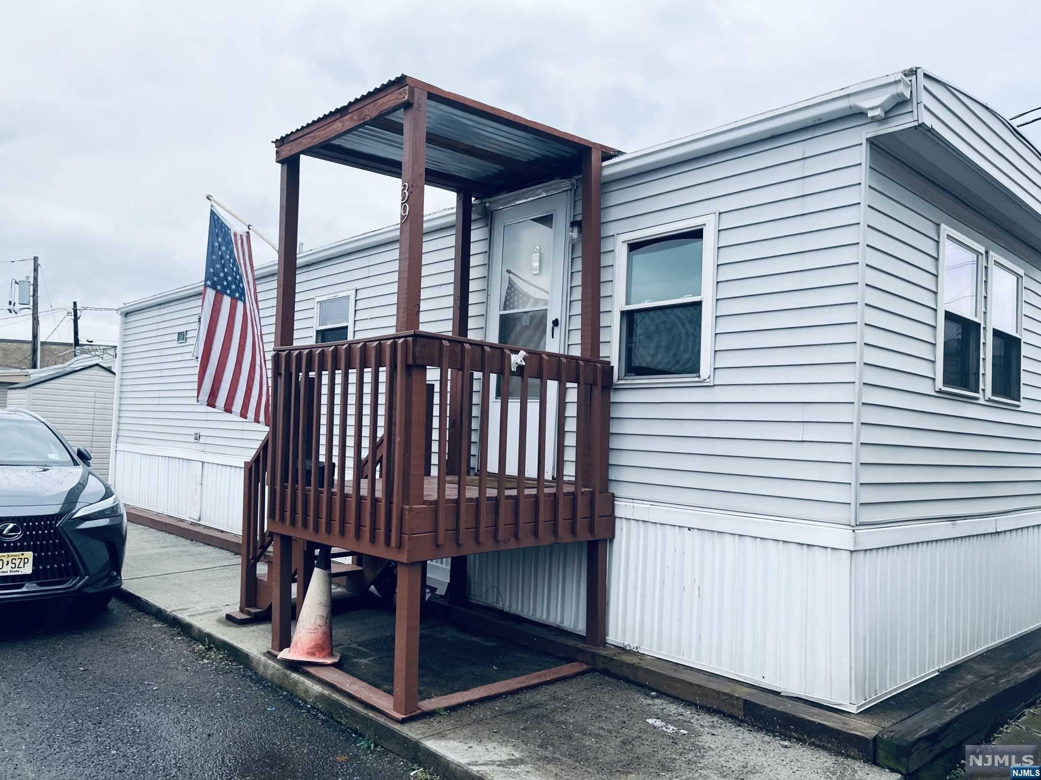 Good location! This mobile home is located only one block into the complex. As per the owner, he never had any flooding in the past 13 years. Approximate size is 13 x 48 sq-ft . There are two parking spaces and a yard. Recent upgrades include :vinyl siding, windows, hot water heater, furnace, new flooring. Spacious Kitchen/living room. Laundry hook-ups. The monthly HOA dues are $1080.00 a month. Includes land taxes, water, sewer, trash, street lights, snow removal. Pool and clubhouse onsite.