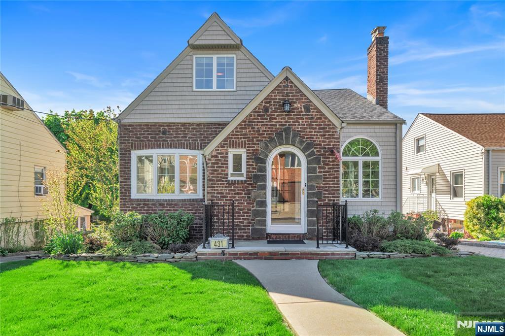 Beautifully maintained and thoughtfully updated Tudor-style Cape located in the sought-after town of Ridgefield. This sun-filled home offers 4 spacious bedrooms and 2 full bathrooms, combining classic charm with modern comfort. Upon entry, youâ€™re welcomed by a charming vestibule with a coat closet, leading into a warm and inviting living room with a gas fireplace. The first floor showcases rich oak hardwood flooring, while the second floor is comfortably carpeted. The eat-in kitchen provides access to the fully finished walk-out basement. The basement expands your living space with a family room, den/office, laundry area, storage closet, and durable tile flooring. French doors open to a beautifully paved patio and landscaped backyardâ€”perfect for entertaining. The backyard also features a shed equipped with electric and water. This home includes two-zone air conditioning (separate units for first and second floors), gas hot water baseboard heating on the main level, and electric heat on the second floor. Additional features include central vacuum, a full sprinkler system, Andersen double-pane windows, and cedar impression siding. The one-car garage is currently used as a workshop with French doors leading to the backyard but can easily be converted back. Situated in a non-flood zone, this property is meticulously cared for and offers both comfort and functionality. Home is being sold as-is.