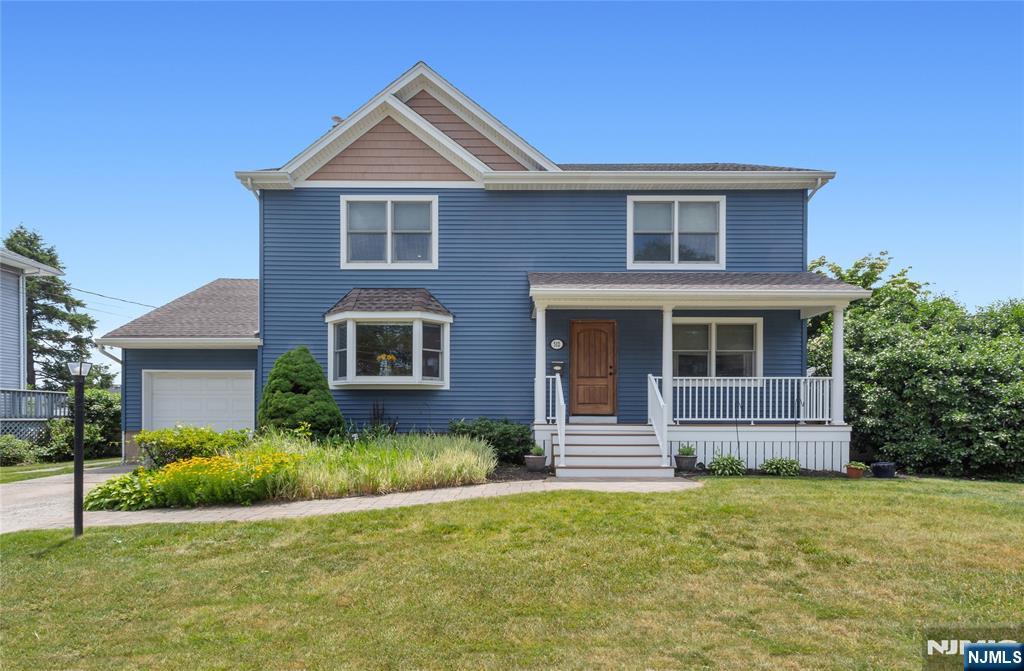 Your home search ends here! Welcome to this beautifully expanded & renovated Colonial, offering the perfect blend of charm, comfort, & modern living. A paver walkway leads to the inviting lemonade porch, ideal for relaxing & enjoying every season. Step inside to a bright living room featuring bay window, hardwood floors, recessed lighting, & stylish barn door. The formal dining opens to the kitchen & includes breakfast bar w/pendant lights, creating an ideal space for everyday living & entertaining. The thoughtfully designed kitchen boasts abundant cabinetry & counter space, granite countertops, subway tile backsplash, & stainless steel appliances. A versatile first-floor bedroom provides flexibility for guests, a home office, or playroom. Powder room, pantry, & coat closet complete the main level. Upstairs, the spacious primary suite features two walk-in closets plus an additional closet & private bath w/dual vanity & shower. Two generously sized bedrooms w/ 2 double closets, full hall bath w/linen closet complete the 2nd floor. The finished basement offers endless possibilities w/large recreation room, office area, laundry room w/shower bath, storage, utility room, & direct access to the garage & backyard. Outside, enjoy summer days in the in-ground pool, entertain on the patio & take advantage of the spacious yard. With exceptional living space, abundant storage & countless updates throughout, this move-in ready home is one you won't want to miss!