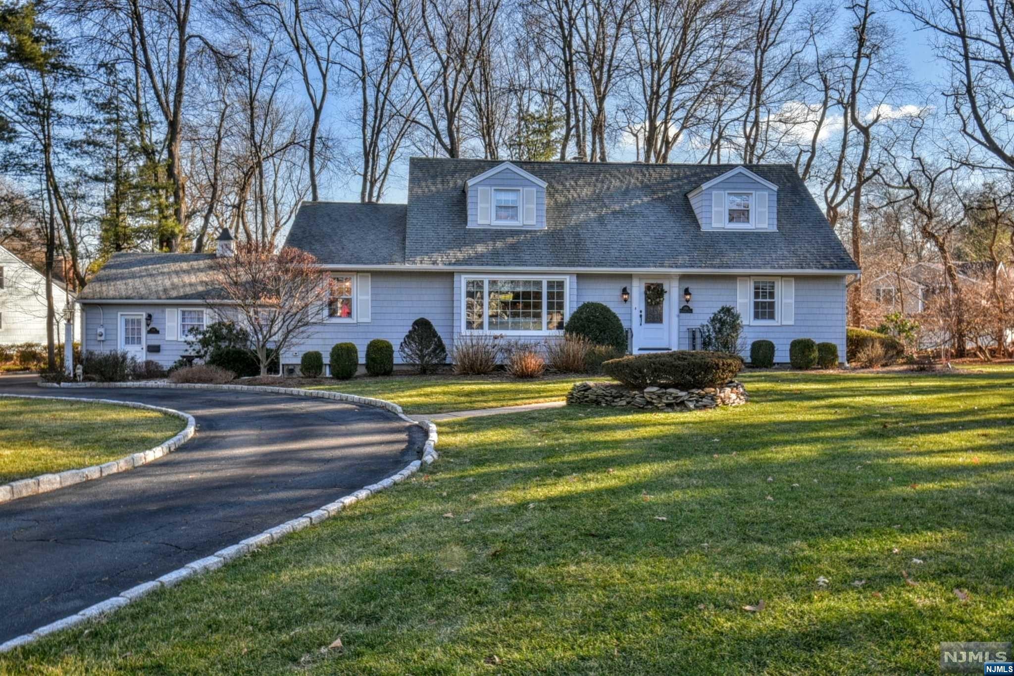 This is the true meaning of a Turnkey home - it has all been updated and beautifully maintained. It is great for entertaining a crowd as well as everyday living. This 4 bedroom 3 bath home w/bright rooms and gleaming hard wood floors is a dream. EF leads to the bright LR and Lg Dining Room and the Open Floor Plan of white Kit w/ Breakfast area is open to the Family Room w/Gas FPL flanked by built-ins. The 1st Floor has the Primary bedroom suite w/FB, a 2nd Bedrm and gorgeous hallway Full Bath. Making this truly convenient, the pretty laundry room w/cabinetry is on the 1st flr along w/the access to the 2car garage. The 2nd Flr has 2 oversized bedrooms and a hallway bath. The Basement is very large, clean and neat.The backyard is flat,lush and private w/a large pretty blue stone patio and gazebo. So many updates and amenities including the kitchen as well as 2 of the bathrooms were renovated in 2015. NYC Bus picks up right outside. Move right in! Septic and house being sold "as is".