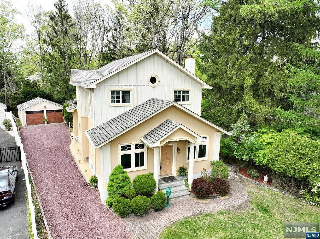 Pride of ownership! Large colonial (around 2500 sqft) in the heart of Hillsdale, the most desirable neighborhood! Step inside and immediately enjoy the huge Entry Foyer. Move through a large living room with wood-burning fireplace, office/sitting room, den, formal dining room with fireplace. Custom eat-in kitchen with granite countertops and stainless-steel appliances opens to a Trex deck overlooking the private backyard. Large bedroom and full bathroom complete the first floor. The second floor offers luxurious primary bedroom with vaulted ceiling. Master bathroom with steam room/shower and jacuzzi tub, plus two additional bedrooms and a full bathroom. A full finished basement with wet bar and powder rm provides additional living space. Hardwoods floors throughout. 9' ceilings. Pella and Andersen windows. Central vacuum. Heated floors. Outdoor kitchen. 2 car garage. Hard wired alarm and fire system Top rated schools, excellent community and easy commute by train/bus to NYC.
