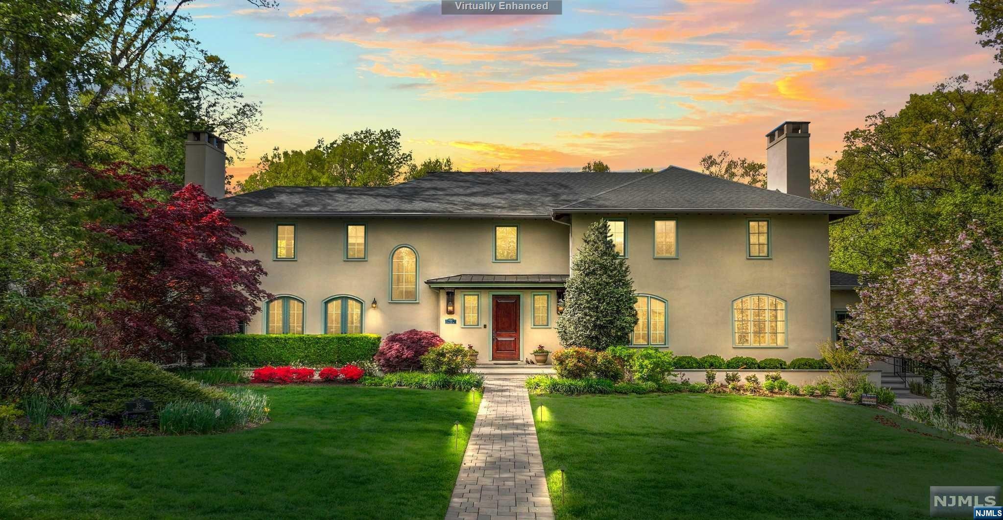 Indulge in unparalleled luxury with this one-of-a-kind Sonoma-style home. Custom-built in 2003 on 1.26 acres of beautifully landscaped land that seamlessly blends with 30 acres of adjacent wooded parkland. The attention to detail and quality of craftsmanship are evident throughout the house, with exquisite millwork, an abundance of natural light, and five fireplaces adding a touch of elegance to every room. The home theater, wine cellar, gym, and billiards room offer endless entertainment options. Step outside, and you will be mesmerized by the stunning outdoor living space. The saltwater pool beckons you to take a dip, complete with a waterslide, spa, and waterfall, creating the perfect spot to unwind. This home is truly a one-of-a-kind premier property in Ridgewood's sought after Old Country Club neighborhood. Don't miss this dream home opportunity!