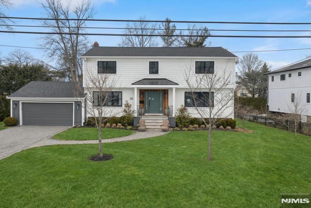 Location that checks every box!! Prestigious Roberts Road area of the North Cliffs. Expanded and extensively renovated Center Hall Colonial offering modern designer finishes and exceptional flow.The sun-drenched gourmet kitchen open to an elegant spacious dining area featuring abundant natural light and a striking contemporary lighting fixture that serves as a stunning focal point, with a fireplace and dramatic floor-to-ceiling windows perfect for entertaining and everyday living. The main level also includes a formal living room, music room/office, a library with custom built-ins, bedroom, full bath, laundry room, and mudroom right from the garage for added convenience. Upstairs, the spacious primary suite offers a beautifully appointed bath with double vanity, soaking tub, and oversized shower, an expansive walk-in closet thoughtfully designed to accommodate an extensive wardrobe with ease. One additional bedroom with a full bath and 2 more bedrooms and a full bath. Basement is finished with a large recreation room,storage and utilities. Major updates done in 2022 and 2023! Newer deck with barbecue grill. Close to park and NYC transportation! A must see!