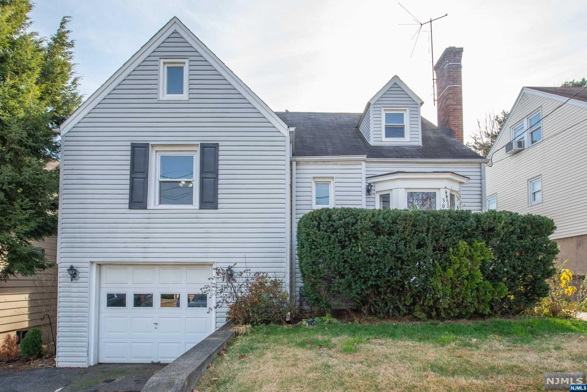 Desirable location walking distance to #3 school. Step inside the vestibule & hang up your coat as you pass thru into the freshly painted LR/DR that incl Hwdflrs under carpeting, fireplace & newer bay window. Recently reno kitchen incl newer cab, countertops & appliances. Sunroom perfect place for a cup of coffee w/ wainscoting & slate floors overlooking fenced in backyard w/ patio & shed. 2 Bdrm and full bath complete main level. Upstairs incl large finished space with endless possibilities. Finished basement, 1/2 bath shower and laundry, as well as entertainment area with built in bar, tool rm with awesome decals and garage access.