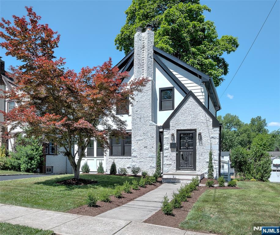 Experience pristine, never-before-lived-in luxury in this meticulously gut-renovated Tudor home, nestled in the heart of West Orange's coveted St. Cloud neighborhood. Step inside to an inviting living room anchored by a cozy wood-burning fireplace. The main level flows effortlessly into a bright sunroom, an elegant formal dining room, and a magazine-worthy chef's kitchen. Upstairs, discover three spacious bedrooms and a sleek, spa-inspired modern bathroom. The finished basement boasts a high-grade epoxy floor and a dedicated laundry setup complete with premium full-sized machines and custom cabinetry. Outside, an expansive backyard awaits your next gathering. Perfectly positioned near parks, shopping, dining, the Turtle Back Zoo, and NYC transit this is a commuter's dream.