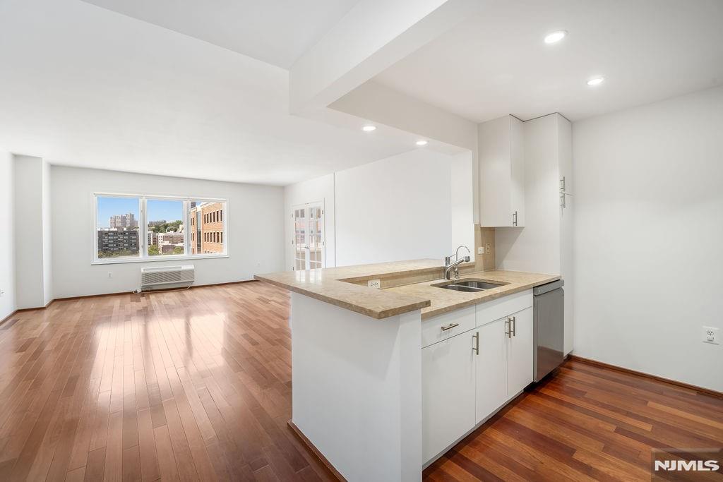 Welcome to your new home in The Peninsula at City Place! This spacious 1128 sq ft 1BR+ Den unit featuring a versatile den space that can serve as a second bedroom or a home office. This Southern facing unit has downtown Manhattan and Hudson River views and fantastic natural light all day long. Newly updated kitchen and bathroom. Spacious throughout with generous storage space. In unit washer and dryer. Conveniently located just minutes from the bus stop to NYC and the ferry. The community also has a well curated collection of retail shops and restaurants on the street level. The Peninsula features 24-hour concierge lobby and a community room. On-site parking for 2 cars is included. Don't miss this incredible opportunity!