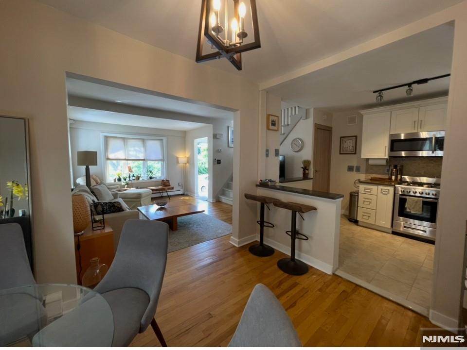 Bright, renovated, and modern home with a cozy feel for rent. First floor features an entry foyer, living room, dining room, updated kitchen, den/office with backyard access to deck, and a full bath. Second floor offers 2 bedrooms and a full bath. Unfinished basement with laundry and plenty of storage. Detached garage, long driveway, landscaped yard. Walk to downtown, schools, and public transportation. Available furnished for $4,350/month. Requirements: Lease application, NTN report, proof of income. Lawncare is included.