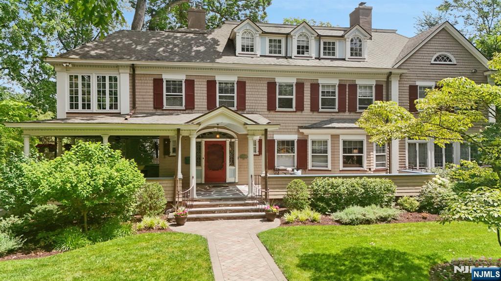 A rare and distinguished offering on one of Glen Ridgeâ€™s quiet, tree-lined streets, this beautifully maintained 1880s Colonial Revival blends historic character and thoughtful modern updates. From the moment you arrive, the wraparound porch and striking presence set a gracious tone. Inside, generously proportioned rooms, architectural detail, and beautifully balanced living spaces are designed for both relaxed daily living and elegant entertaining. Offering 6 bedrooms, 5 full and 2 half baths, a playroom, and a private office, this home combines grand scale, easy flow, and the kind of warmth and sophistication that is increasingly hard to find. The luxurious primary suite is a true retreat, unfolding across three separate rooms: the primary bedroom with an en suite, a cozy sitting room with a fireplace, and a dressing room. The other en-suite bedrooms provide exceptional comfort and flexibility for family and guests alike. Rich in history and built by noted Glen Ridge developer Asabel Darwin, the home has been thoughtfully updated to honor its original integrity while enhancing comfort and function. The detached oversized two-car garage provides ample storage and added convenience. With its inviting layout, expansive backyard, and proximity to schools, parks, and town, the home offers an ideal setting for modern living. All of this is just .3 miles from the Glen Ridge train station, offering an easy commute to New York City. This gorgeous home is not to be missed.