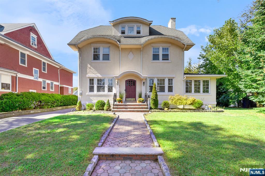 This beautiful single-family colonial is in located on a quiet tree-lined street. The home features 4 bedrooms and 2.5 bathrooms. This residence is located in a prime location, offering a wonderful balance of all the character and charm of a classic Rutherford home. The main level entry foyer leading into a formal dining room is connected to a spacious living room with a beautiful stone wood burning fireplace. The double French doors leading off the Living room enter into a bright sunroom, abundant in natural light. The chef's kitchen features a generous center island, granite countertops, rich cherry cabinetry, and Viking appliances. Hardwood floors flow seamlessly throughout the home. The second floor offers three generous bedrooms and a modern 4-piece tiled bathroom. For added convenience, the laundry room is thoughtfully located on the second floor. The top level is complete for a full primary or teen suite, full bathroom, vaulted ceilings and walk in closet. The full finished basement provides additional recreational space and ample storage. Entertaining is effortless with double sliding doors that open to an expansive lighted Trex deck overlooking the large backyard to the heated inground lighted pool. Whether hosting gatherings or summer barbecues, this outdoor space is designed to impress. Additional features include a detached one-car garage and a driveway accommodating 3+ vehicles. Seller is the agent Donâ€™t wait â€“ make this your home today!