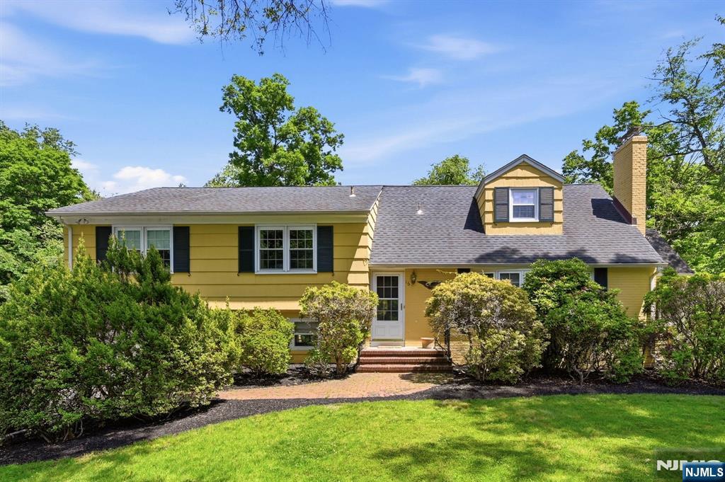 Location! Location! Set in top neighborhood on 1/2 acre property, this spacious expanded multi-level split features large rooms throughout and a flexible floor plan. Entry foyer welcomes you into the gracious living room with a fireplace, formal dining room leading to a bright three-season room, and country kitchen. Upstairs is the large primary suite with private bath and two additional generous bedrooms and skylit main bath. On the third floor, you will find additional living space with powder room--perfect for a library, den, or fourth bedroom. The ground level family room with sliding doors to your tranquil private back yard is ideal for entertaining! There is a bonus room with skylight off the family which can be used as a studio/home office, or playroom plus a finished recreation room. Enjoy lots of space to create your dream home! Conveniently located to schools, shopping, and transportation.