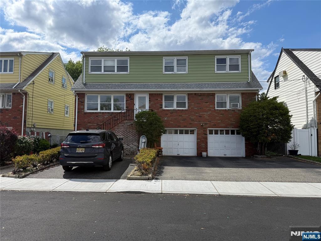 Exceptional investment or owner-occupant opportunity! This spacious top/bottom 2-family home in Little Ferry features 6 bedrooms and 2.5 bathrooms. Situated on a quiet dead-end street with excellent curb appeal, the property boasts a large 2-car attached garage plus a massive driveway with parking for 6+ cars. Highlights include separate utilities, a full basement with 1/2 bath, summer kitchen, and an expansive backyard. Unbeatable location close to shopping and steps from NYC transportation. Live in one unit and rent the other, or capitalize on high area rents for maximum return of investment.
