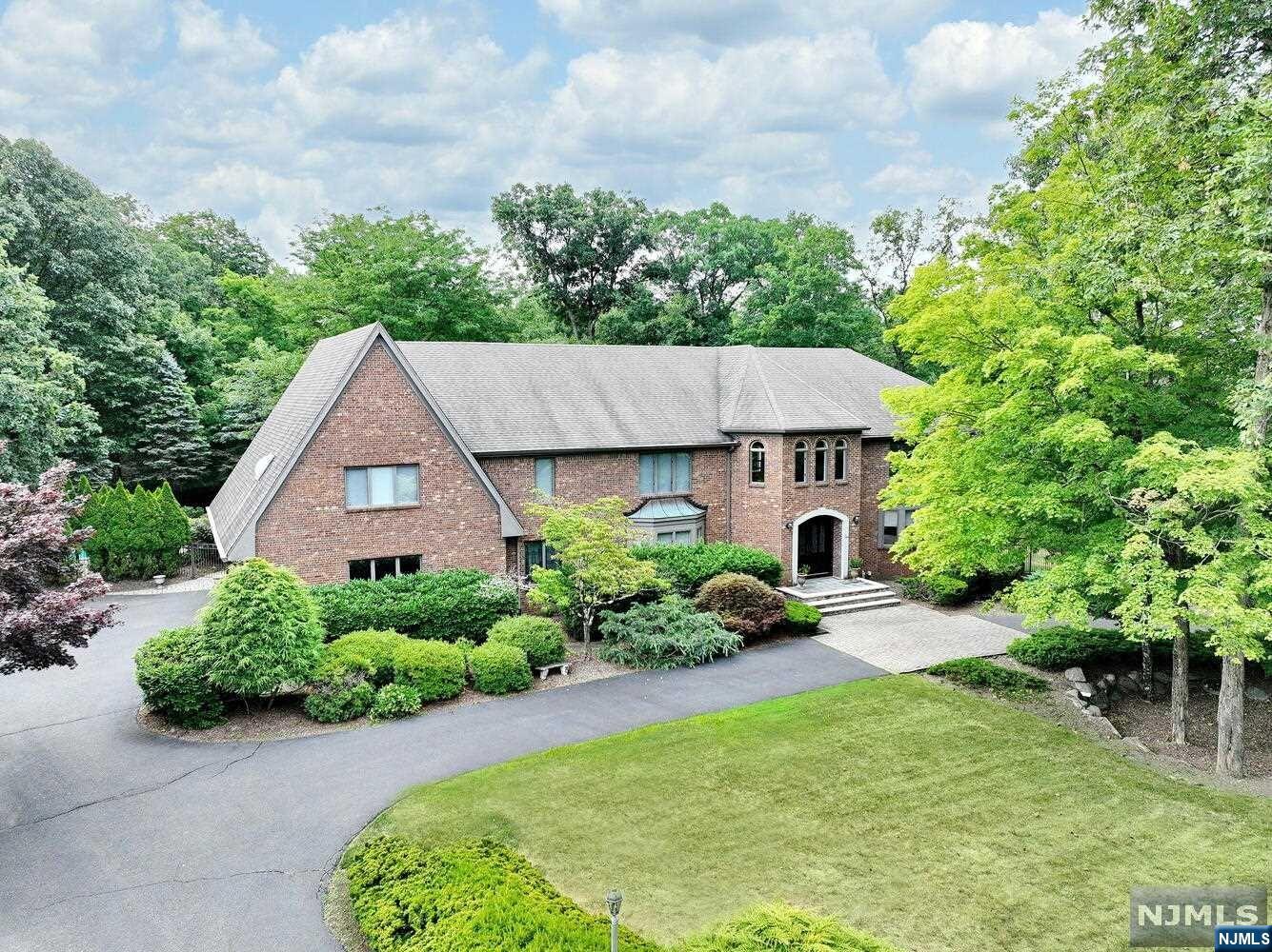 Welcome to this stunning Manor home located in the highly desirable High Woods Gate section of town. Upon entering this exceptional renovated home the elegant two story Foyer will lead you to a sunken Living Room/Game Room, banquet sized Dining Room, Great Room complete with wet bar, wood burning stone fireplace, soaring ceiling height, and spacious Chef's Kitchen with separate sun-drenched Dining Area. The 6th Bedroom, Full Bath, Powder Room, Laundry Room,and Back Staircase to second level are the final touches to the first floor. The second floor offers an over-sized Primary Bedroom Suite with Dressing Area, multiple closets, and Bath with soaking tub and large shower, four additional Bedrooms, Main Bath, and Library Nook. The lower level with gym, entertaining spaces, Full Bath and storage and utility rooms complete this gracious home. The private rear yard offers endless possibilities for poolside fun and a large patio with dining space.