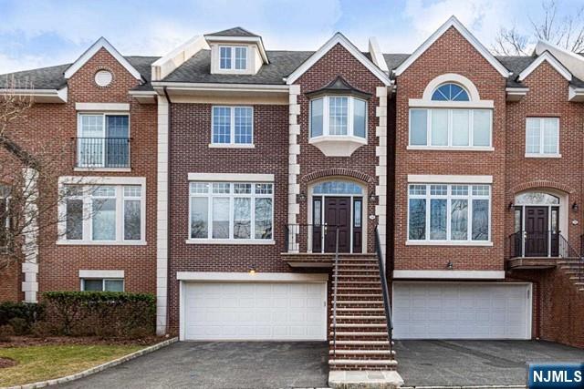 Renovated with luxury line of appliances, fixture and more. 3700 sqft. You have to come and look! Excellent School district and luxurious townhouse in Northern Valley's prime Old Tappan community. Close to NYC transportation. Bright open floor plan! Large living room and dining area featuring high ceilings. Updated kitchen with quartz counter tops, stainless steel appliances, walk-in pantry and huge island. This opens to family room with fireplace. Sliding doors to spacious deck that backs up to woods great for entertaining! Second level offers expansive master suite with 2 walk-in closets and large bath featuring granite counter tops, jetted tub and separate shower. Two additional spacious bedrooms, updated full bath and lots of closets space complete this level. Fully finished lower level offers additional family/bonus room, laundry room, full bath, garage entry, and sliding doors to private pave patio. 2-car attached garage. Check virtual tour! Move-in fee $500(no refundable). Owner has NJ Real Estate License.