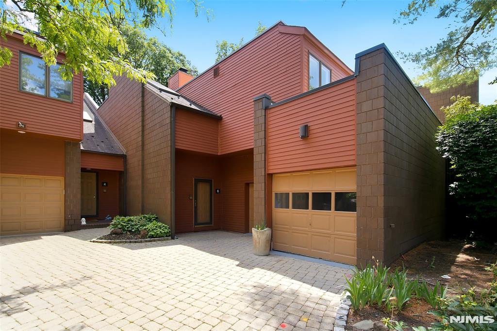 Simply Stunning 3 bed 3.1 bath townhouse in Oak Trail, a gorgeous gated community with 24 hr gate guard. The unit is huge with high ceilings and skylights and a gorgeous open layout!. The first floor offers a spacious entry foyer, hardwood floors, living room w/fireplace, dining room w/sliding glass doors leading to a deck with a private yard! There is also a magnificent kitchen with eating island , a stunning powder room and a full laundry room . Upstairs is the massive Primary bedroom with fireplace, tremendous walk in closet and spa like bathroom with SS and soaking tub. Down the hall are the two other large bedrooms and a bath. Additionally there is a huge, fully finished basement with two rooms and a full bath plus storage galore! The complex is fantastic and has a pool , is pet friendly and close to all local conveniences, highways and NYC. The unit is being sold in "as is" condition. Come see for yourself!