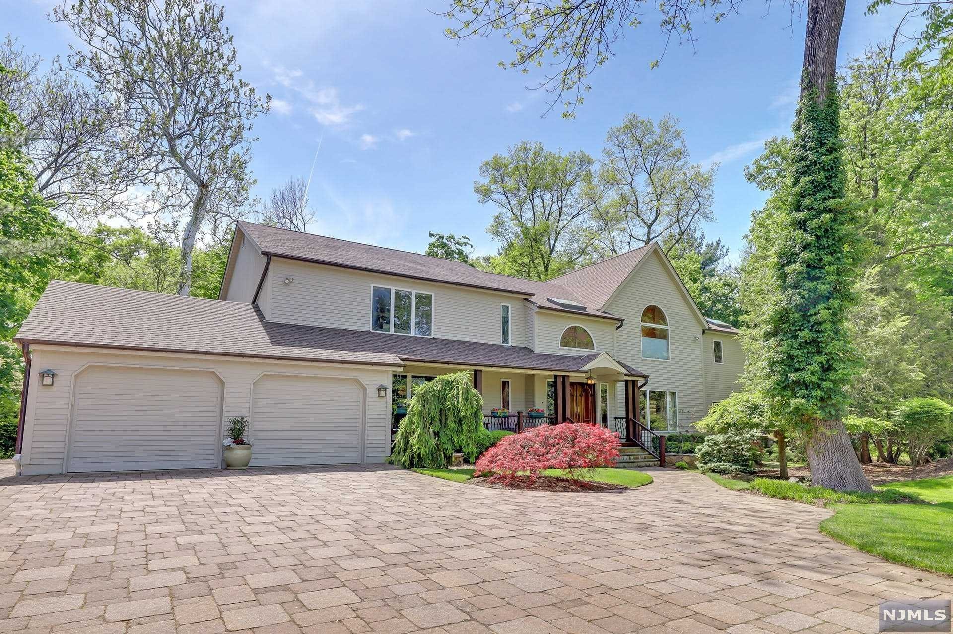 ONE OF A KIND on one of Closter's East Hill cul de sac's.Over 3/4 acre of stunning,flat property!This custom built and immaculately maintained home features a 2 story entry foyer with stunning solid wood moldings and trim,formal dining room,oversized open concept living room/family room,huge kitchen with breakfast area and high end appliances,den/gym with separate access to the primary suite,junior suite with full bath on main level..all with huge windows overlooking the breathtaking private backyard.In the primary suite you'll enjoy 2 walk in closets, large primary bath, balcony overlooking the expansive yard AND 2 separate offices! 3 more bedrooms, full bath and jack and jill bath complete the 2nd level.Huge finished basement w/ summer kitchen,media room,rec room and storage. The MAGICAL backyard is absolutely breathtaking with a huge deck spanning the back, a bridge extending over a babbling brook & mature landscaping.A few blocks from the Closter Plaza and Hillside Elementary.