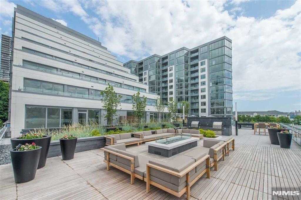 Presenting a rare opportunity to experience high-end luxury living in the heart of the Gold Coast with sophisticated design and unparalleled comfort. This pristine 1,140sf 2BR2BA condo boasts a gourmet kitchen with custom Italian Pedini cabinetry, quartz stone countertops, Bosch and Thermador built-in refrigerator, perfect for culinary enthusiasts. Enjoy a master bedroom suite with a walk-in closet, a generous sized second bedroom, two bathrooms designed with luxurious marble finishes. Convenience in-unit washer/dryer, making laundry day a breeze. Beyond the unit, indulge in stupendous resort style amenities which include 24-hour Doorman, state-of-the-art fitness center, indoor garage with one free parking space, rooftop deck, resident lounges, business center, kids playroom, bike room, pet grooming facility and a promenade deck with a infinity edge pool, lounge and BBQ areas, The courtyard is located on the same floor! This unit comes with 1 free parking garage space (#121). Enjoy the tax abatement benefit for 13 more years. Discover the upscale living at its finest.