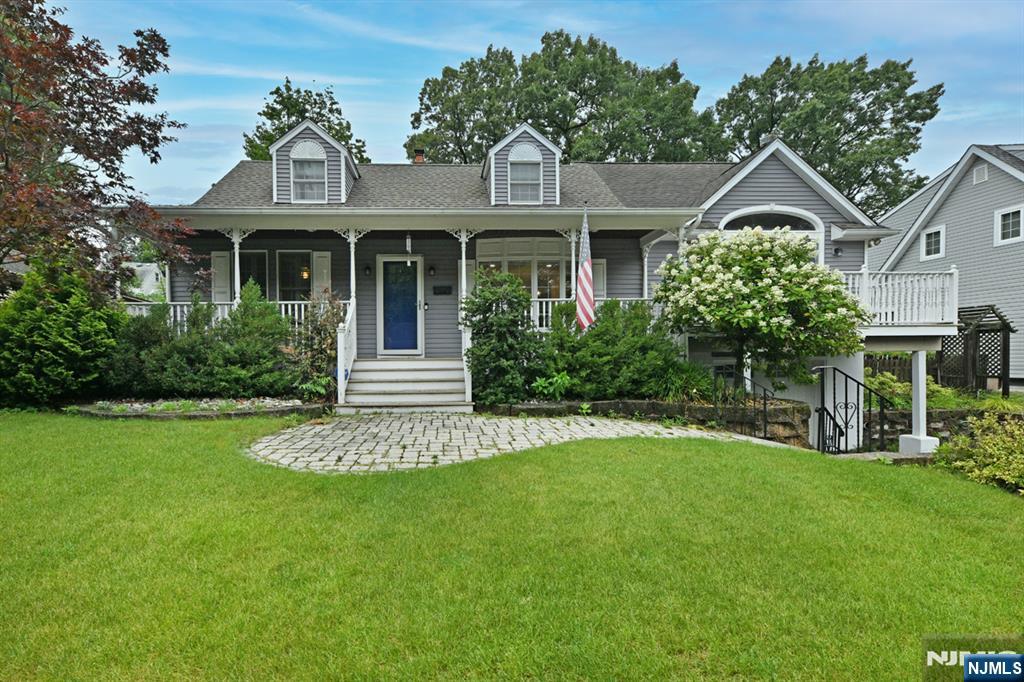 Absolutely stunning and truly move-in ready! This expanded 4-BR, 2-bth Cape Cod offers approximately 1,835 sq ft of beautifully designed living space, plus a finished basement, and is much larger than it appears A charming covered front porch provides a warm welcome into this immaculate home Beautiful hardwood floors on 1st floor Quality craftsmanship is evident throughout The spectacular newer kitchen is the heart of the home, featuring quartz countertops, a breakfast bar, separate breakfast area, elegant glass tile backsplash, stylish pendant lighting, and abundant cabinetry The formal dining rm flows into the impressive 24'3" x 14'7" Great Room, showcasing a soaring cathedral ceiling w/rustic wood accents, a gas fireplace, ceiling fan & 2 private balconies 2 spacious bedrooms and an updated full bath on each level provides exceptional flexibility The finished basement offers a large family/media room and room for a home office, gym, or playroom Additional highlights: Newer roof (approx, 2 yrs old), 2-zone central air, 4-zone gas HW BB heat, newer gas furnace (approximately 6 yrs old), ceiling fans, gutter guards, u/g sprinklers, & an attached 1 car garage w/interior access Step outside to your private backyard retreat featuring a beautiful paver patio with a built-in fire pit Located in a wonderful neighborhood within one of Bergen County's most desirable communities, this exceptional home offers the perfect combination of comfort, style, space & convenience