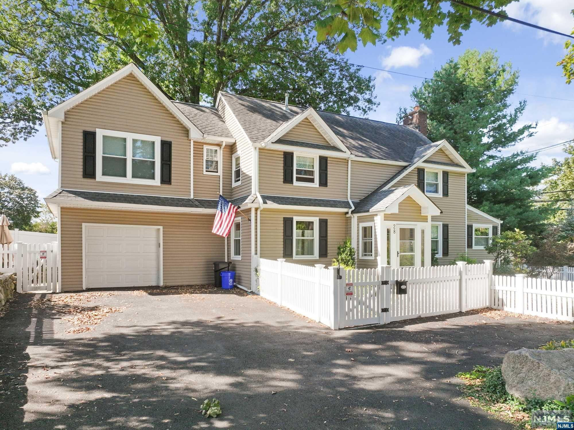 This magnificent 4-bedroom, 3-full bathroom center hall colonial offers the perfect blend of comfort, style, and convenience. Nestled near the center of town, this home is close to restaurants, shops, and transportation (calling all commuters!). As you step inside, you'll be greeted by an abundance of natural light. The kitchen, dining area, and living room boast gleaming hardwood floors, creating a warm and inviting atmosphere. The centerpiece of the living room is a stunning marble fireplace, perfect for cozy evenings with loved ones. The kitchen features granite countertops and stainless steel appliances, as well as a center island. The main level is thoughtfully designed for hosting memorable and enjoyable gatherings. The 2nd floor features 4 spacious bedrooms, complete with ensuite bath and walk-in closet in the primary bedroom. Laundry is also conveniently located on the 2nd floor. The basement offers endless possibilities - make it your home gym, home theater, or relaxation