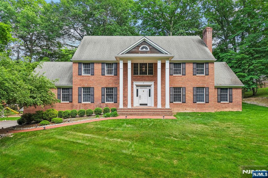 Nestled at the end of a scenic cul-de-sac in sought-after Upper Saddle River, this 5-bedroom, 3.5-bathroom was thoughtfully designed for both everyday living and entertaining. The residence features a dramatic two-story great room with a fireplace, creating a stunning focal point filled with natural light. An elegant living room with a second fireplace provides an inviting setting for gatherings or quiet evenings at home. The spacious eat-in kitchen opens through glass doors to a covered porch, creating a seamless transition for indoor-outdoor living. The first floor also offers excellent flexibility with a potential fifth bedroom featuring a pre-plumbed en-suite bath - ideal for guests, a home office, or extended living. Upstairs, four well-appointed bedrooms include a primary suite complete with a sitting room or office, walk-in closet, and full bath. An unfinished basement with high ceilings presents possibilities for additional living space, while the attached 2-car garage offers ample storage and convenience. The expansive backyard offers endless opportunities for recreation, gardening, or future enhancements. An opportunity with limitless potential in one of Bergen Countyâ€™s most desirable communities.