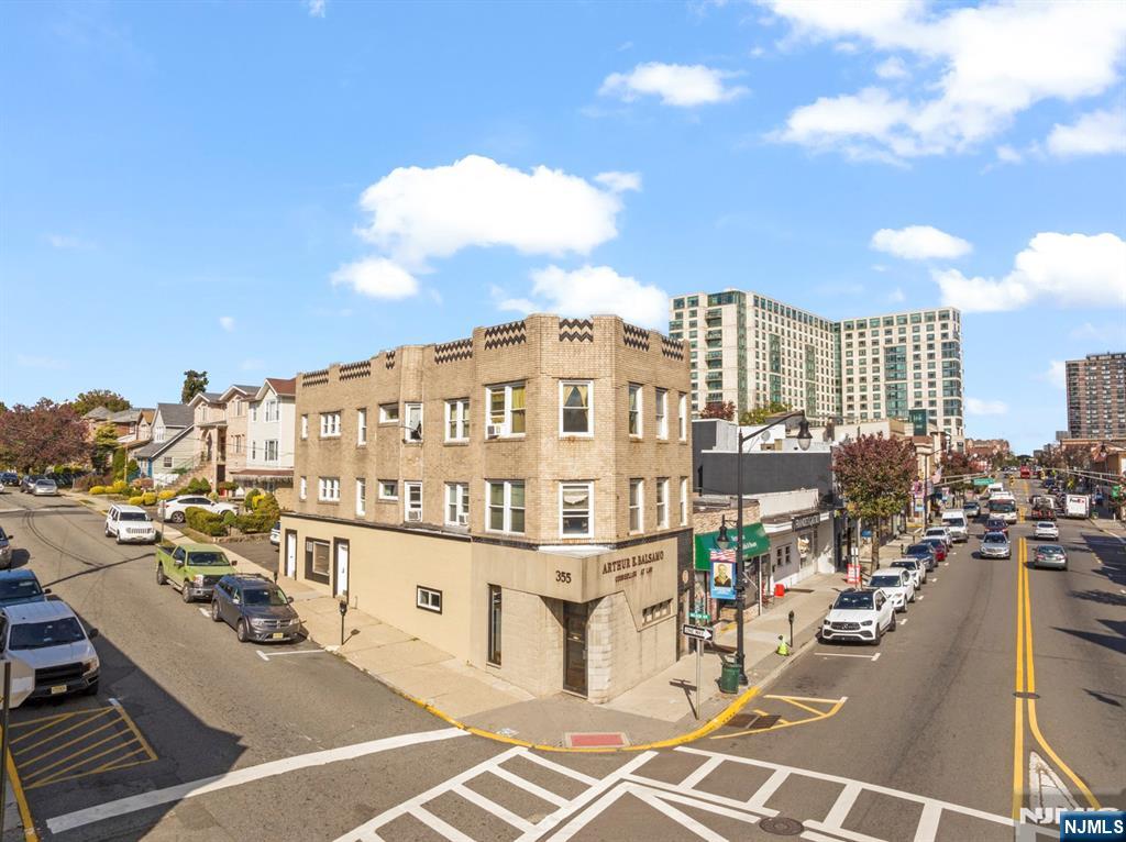 Great location" in the center of downtown with high visibility. Shares the cross walk with Wells Fargo bank. This property was last sold in 1976! This Art deco style building lies on a 100x26"ft corner lot: Most of the building has south exposure for lots of sunlight. Mixed use with Professional offices on 1st two floors. First floor can be two separate spaces with retail in front (with one bathroom) and office in back with separate entrance and one bathroom. The second floor has dual access from Anderson & Nelson Ave. w/one bathroom. Possible to convert to two apts. with the same floor plan and the top floor. The property comes with 3/4 car parking spaces, 5 boilers, 6 separate electric meters, central air on the 1st floor, front and back stairwell. The building has a new roof, and the two rental units were renovated, approx. 3 years ago. The decommissioned oil tank is still in the ground & the owner has the accompanying documents. The decommissioned oil tank is still in the ground & the owner has the accompanying documents. Building is being sold "as is". Top floor has view of the Empire State building. Better views from roof if another floor was added or converted to a roof deck. Current apt. income is $1,550 + $2,200 (both mo. to mo. tenants). Owner will not deliver apts. vacant but will deliver 1st & 2nd floors vacant. Once updated the total rent projected is $160,000 (conservatively) to $179,000 or more.