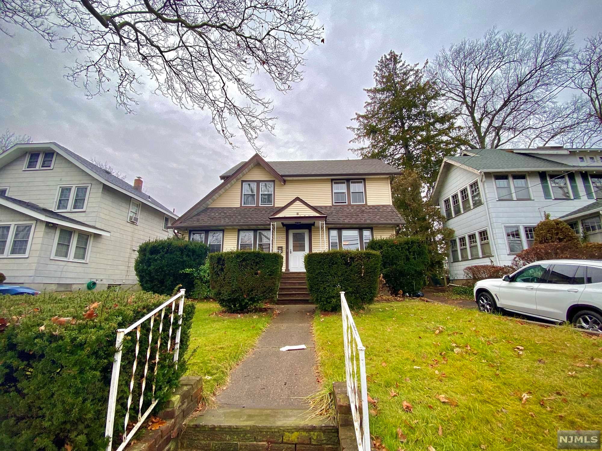 Just in time for the New Year, welcome to this stately colonial in the leafy suburbs of Teaneck! Close to Cedar Lane shopping and easy route 4 access to NYC. Long driveway and large front yard. Come inside and rest by the formal fireplace with room for seating. Large living room for entertainment. Original glass french doors lead to large dining room and kitchen. Upstairs are 3 bedrooms and a full bath. 3rd floor attic is huge with room for endless opportunities! The basement features a summer kitchen, room for recreation, and a bathroom with shower. Expansive backyard features an in-ground pool with new liner.