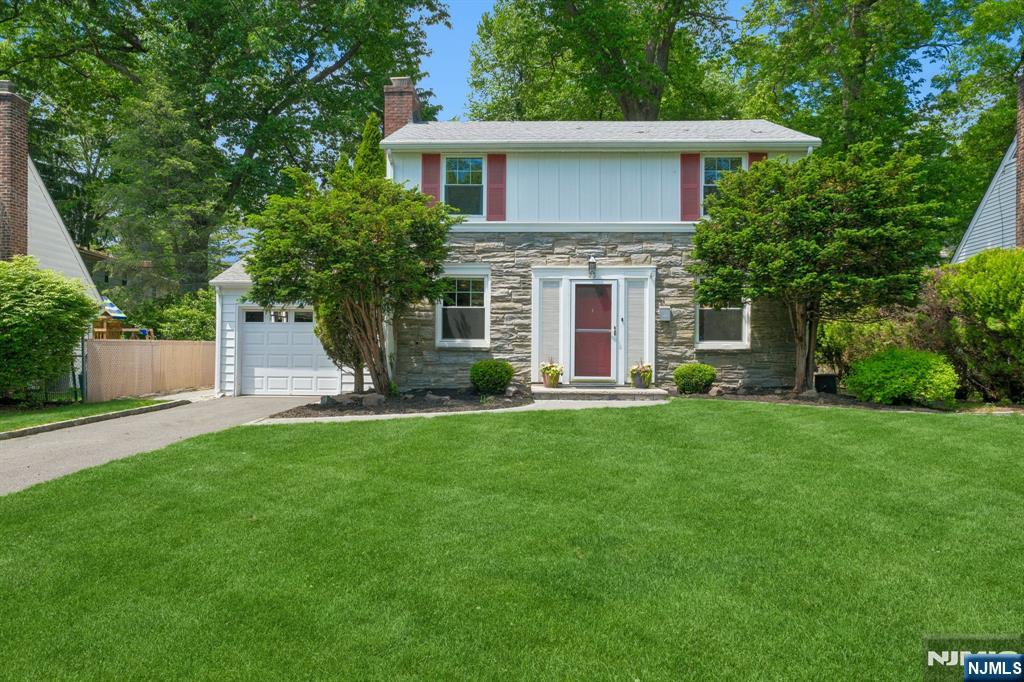Welcome to 23 Benvenue Avenue - a bright, happy retreat tucked into West Orange's beloved St. Cloud neighborhood. Thoughtfully cherished by music lovers with a wonderful sense of style and warmth, this inviting home offers 3 spacious corner bedrooms, 1.5 baths, and beautifully flowing spaces designed for easy living. The kitchen has lots of counter space, a pantry and opens seamlessly to the dining area, while the living room and den create wonderful gathering space filled with light and cheerful energy with french doors so you can divide it into two spaces if you wish! Access to the backyard from the den. A first-floor powder room adds convenience, and the finished lower level offers generous entertaining space plus an additional room ideal for a home office, gym, or creative studio. Outside, the fully fenced private backyard with mature landscaping feels like a hidden sanctuary complete with an inviting paver patio ready for morning coffee, dinners, or summer nights under the stars. An attached one-car garage and nearby NYC bus access make everyday life remarkably easy. Fresh, welcoming, and filled with joyful energy - 23 Benvenue Avenue is the kind of home that instantly feels good to come home to.