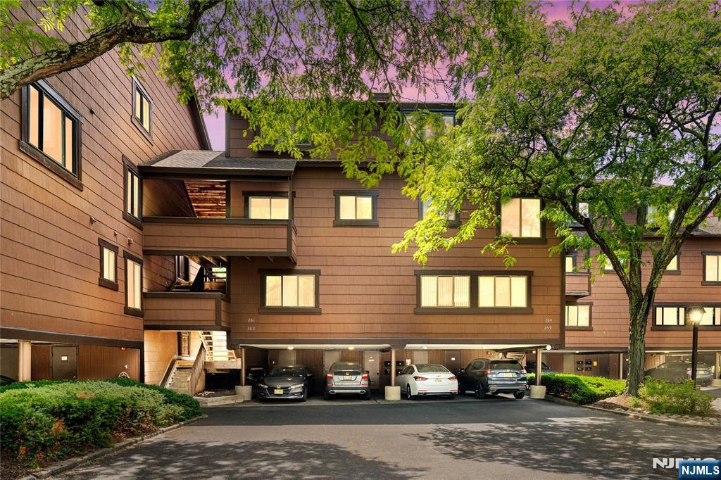Welcome to resort-style living in the highly sought-after gated community of Harmon Cove. This beautifully renovated 2-bedroom, 2.5-bath unit seamlessly blends modern design with everyday comfort, offering a turnkey opportunity just one stop from New York City. Step inside to discover soaring ceilings, abundant natural light, and an open-concept layout designed for both relaxing and entertaining. The spacious living room is anchored by a dramatic floor-to-ceiling fireplace and flows effortlessly into the dining area and stunning designer kitchen featuring custom cabinetry, quartz countertops, stainless steel appliances, and stylish finishes throughout. Upstairs, you'll find two generously sized bedrooms, including a spacious primary suite with its own private bath. A dedicated laundry room, beautifully updated bathrooms, and thoughtful renovations throughout make this home truly move-in ready. Enjoy all that Harmon Cove has to offer, including 24-hour gated security, swimming pool, clubhouse, marina, tennis and basketball courts, walking and jogging trails, playground, and beautifully maintained grounds. Commuters will appreciate direct access to NYC transportation, including bus service to Port Authority and nearby train service to Penn Station. Experience the perfect combination of waterfront community living, modern updates, and unmatched convenience in one of Harmon Cove's most desirable residences.