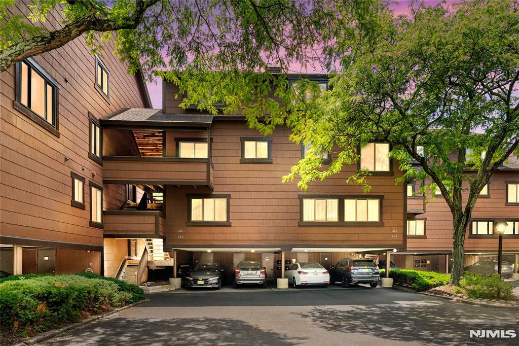 Welcome to resort-style living in the highly sought-after gated community of Harmon Cove. This beautifully renovated 2-bedroom, 2.5-bath unit seamlessly blends modern design with everyday comfort, offering a turnkey opportunity just one stop from New York City. Step inside to discover soaring ceilings, abundant natural light, and an open-concept layout designed for both relaxing and entertaining. The spacious living room is anchored by a dramatic floor-to-ceiling fireplace and flows effortlessly into the dining area and stunning designer kitchen featuring custom cabinetry, quartz countertops, stainless steel appliances, and stylish finishes throughout. Upstairs, you'll find two generously sized bedrooms, including a spacious primary suite with its own private bath. A dedicated laundry room, beautifully updated bathrooms, and thoughtful renovations throughout make this home truly move-in ready. Enjoy all that Harmon Cove has to offer, including 24-hour gated security, swimming pool, clubhouse, marina, tennis and basketball courts, walking and jogging trails, playground, and beautifully maintained grounds. Commuters will appreciate direct access to NYC transportation, including bus service to Port Authority and nearby train service to Penn Station. Experience the perfect combination of waterfront community living, modern updates, and unmatched convenience in one of Harmon Cove's most desirable residences.