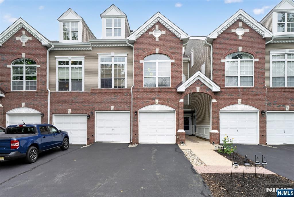 Welcome to this beautiful 3-level townhome located in Stony Ridge community. Boasting 2 bedrooms and 2.5 bathrooms, this multi-floor unit offers a comfortable living across three finished levels. The main level features a spacious living room with balcony access, a dining area, and an updated kitchen with a breakfast bar. The laundry room and attached 1-car garage are also accessible in the main level. The upper level features a master bedroom with balcony access, walk-in closet, master bathroom with a tub and separate shower, along with a second bedroom and full bath. The finished basement provides additional living space and a bar area with access to a private patio. Conveniently located near Rt 287, Wanaque Ridge trails, shopping, and dining.