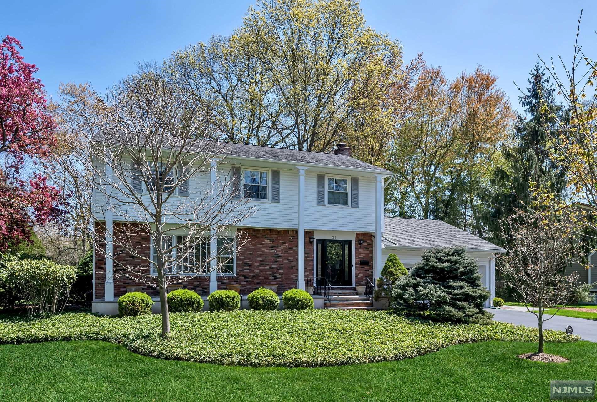 SPACIOUS and well maintained 4 Bedroom, 2 1/2 Bathroom Colonial on approximately HALF ACRE beautifully manicured property in fabulous location! Cozy family room w/marble gas fireplace provides access to the Trex deck perfect for relaxing & grilling. Expanded eat-in kitchen includes breakfast nook with bay window, custom cabinetry and granite counters. Spend holidays entertaining in the bright formal living room & dining room open to each other w/hardwood floors. Large bedrooms including a primary suite; great closet space; mudroom/laundry room off of 2 car garage; generator; security system; and underground sprinklers. Full basement being used as a finished space. Hardwood flooring under bedroom carpeting. AMAZING BACKYARD with tons of room to run and play. PRIME LOCATION in beautiful neighborhood close to town park, playground, NYC transportation, school, shops and restaurants. Harrington Park is a hidden gem with it's award winning schools and close knit community!