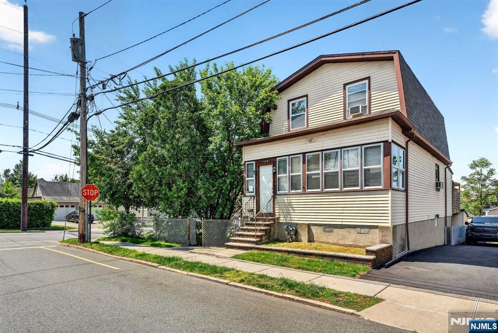 HOTTEST 2-Family home on the Market located in the heart of vibrant DOWNTOWN GARFIELD offering a RARE OPPORTUNITY FOR BOTH OWNER OCCUPANTS & INVESTORS just 18 miles to NYC! Featuring TONS OF PARKING with 5 Driveway Parking Spots including a BONUS Carport. Experience this charming Top / Bottom 2-Family showcasing plenty of living space designed for today's modern lifestyle allowing the perfect blend of comfort, flexibility, and commutability to NYC. The Second Floor Unit features a TWO-STORY DUPLEX with spacious Family Room, Living Room, Sunroom, Eat-In Kitchen highlighted by Granite Countertops, custom Cabinetry, Backsplash & Stainless Steel Appliances, 2 Bedrooms, a Full Bathroom, Laundry Room & access to your very own Private Deck with Pergola. The First Floor Unit offers a large Family Room, Eat-In Kitchen, Bedroom, Walk-In Closet & Full Bathroom. Property includes a MASSIVE Yard Space and tranquil Patio ideal for Entertaining, Hosting or Relaxation. Amazing commuter location just minutes from Train and Bus access to NYC, close to schools, public transportation, shopping, eateries, and major highways. Come make this exceptional 2-Family home yours before someone else does!