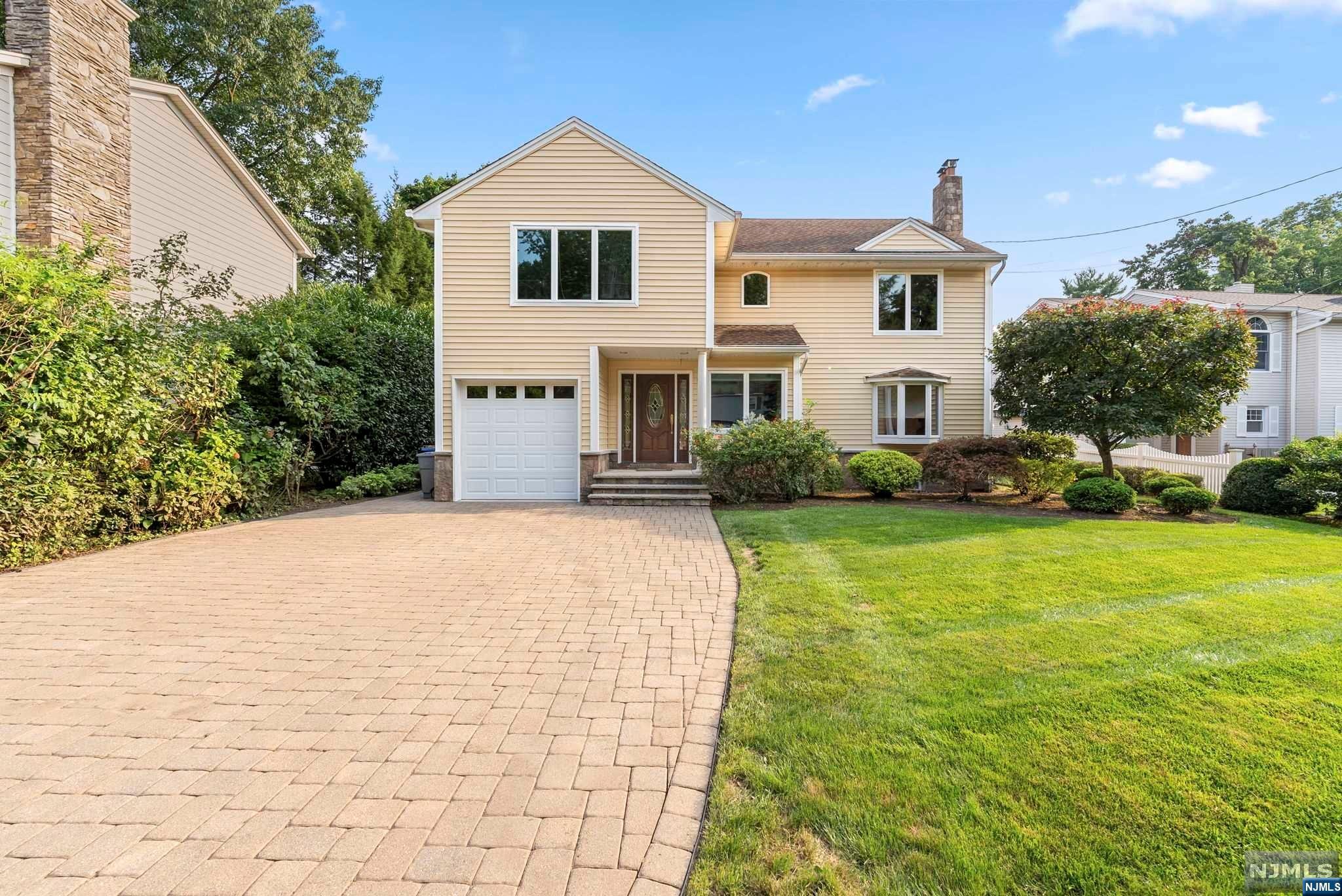 Situated on a quiet dead end street, one-block from top-rated elementary school, beautiful curb appeal, and great living space (2300+ sf) complete this center hall colonial. Expanded and renovated in 2013. Be greeted through a sun-filled entry foyer. Create memories of laughter and joy through the welcoming dining space. Open Kitchen features plenty of storage with wood cabinetry, granite countertops, stainless steel appliances & fixtures. First floor also features a living room with wood burning fire place, private bedroom/den and an updated full bathroom. Entire first floor is heated through radiant heated floors. Ductless HVAC heat and cool first and second floors. Second floor features 2 more generous size bedrooms, full hallway bathroom, and massive primary suite with walk in closet, rain shower head, steam shower, heated towel rack and massive bedroom space. The serene backyard has been meticulously landscaped with a relaxing raised paver patio to unwind from the day.