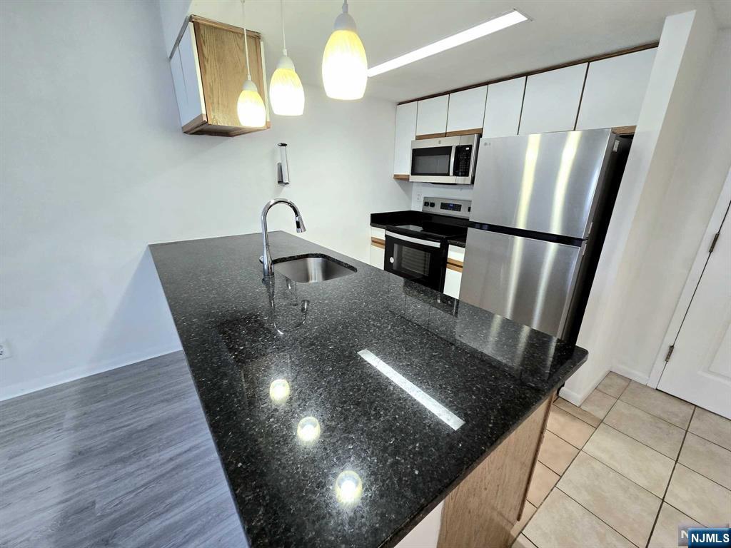 Welcome to the Desirable Fairmount Section of Hackensack! Conveniently located within walking distance to Anderson St. Train Station and NYC Bus Stop. Close proximity to stores, restaurants, banks and more! Open Concept Layout with New Flooring throughout. Brand New Stainless Steel Appliances and New Granite Counters. Spacious Primary Suite featuring Walk-in Closet and Jacuzzi Tub, plus separate Powder Room for guests! All the Space you need with Low Monthly Maintenance! One pet under 25 lbs. ok. Investors welcome, can immediately rent out.