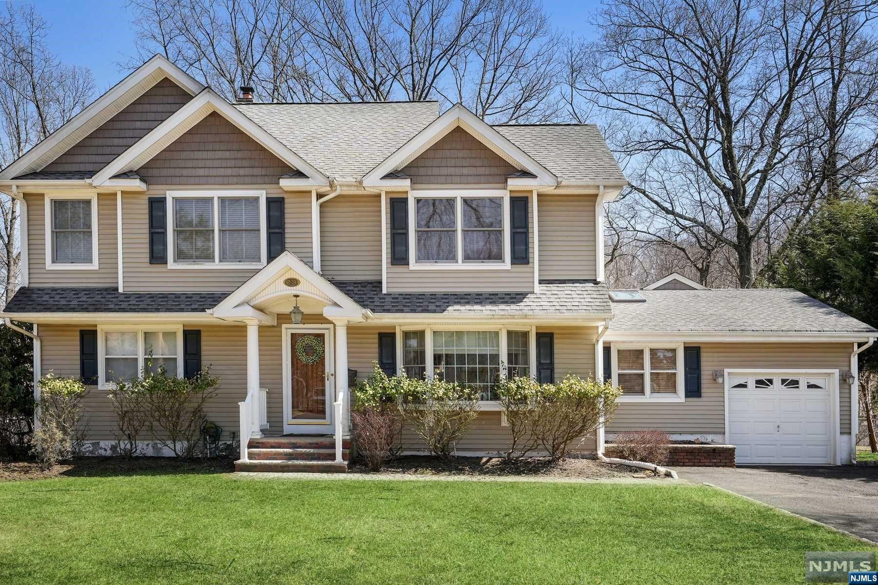 Updated and Renovated colonial house located in a quiet residential block, minutes away from downtown, shopping, train station, schools, and the amazing Ramsey pool complex. You will love the family room with soaring cathedral ceiling, walls of windows and brick fireplace. Sunny kitchen with granite counters, formal dining and living room, two bedrooms and beautiful newer full bathroom complete the first floor. Second floor offers gorgeous master bedroom with tray ceiling, sitting area & enormous walk-in closet. Luxurious spa bathroom is a show stopper with jacuzzi soaking tub& oversized seamless multi body jetted shower. The additional bedroom is also tremendous in size, lustrous hardwood floor flows throughout this level. A 3rd bathroom& impressive rec room, plus abundant storage can be found on the lower floor. Private rear yard with wooded views & 2 tier deck. HOUSE is NOT in flood zone. Owner does NOT pay flood insurance.