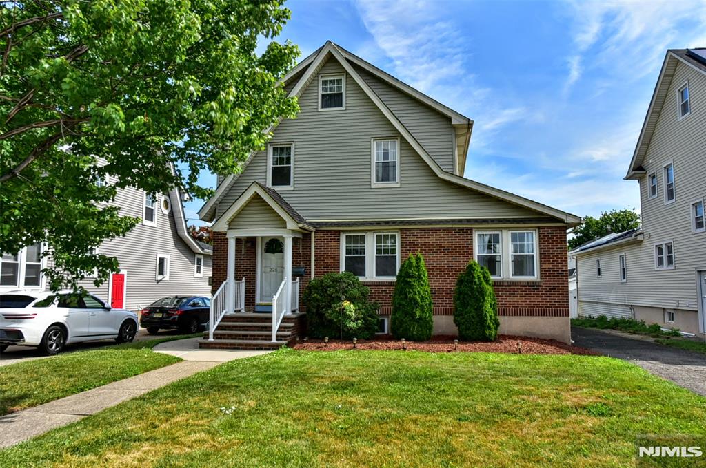 Brimming with timeless charm and character, this stately brick Colonial offers the perfect blend of classic architecture, comfortable living, and future potential. The spacious floor plan features a large living room with an elegant fireplace, a formal dining room, cozy den, and a sun-filled sunroom, creating inviting spaces for both everyday living and entertaining. A convenient first-floor powder room adds functionality, while beautiful hardwood floors enhance the home's warmth and appeal. The second level offers three generously sized bedrooms, providing ample space for family, guests, or a home office. A walk up attic presents exciting future potential for additional finished living space, whether envisioned as a recreation room, guest suite, private retreat, or work-from-home space. Recent improvements include a newer roof, offering added peace of mind for years to come. Ideally located one block to the elementary school and NYC transportation, this home combines classic charm, modern convenience, and exceptional potential. A rare opportunity to enjoy a desirable lifestyle in a location that makes commuting and daily living effortless.