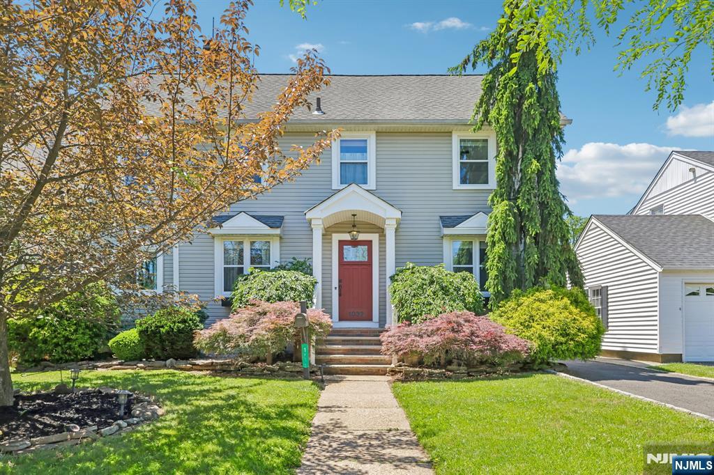 Welcome home to this charming 5-bedroom, 3 full bath Colonial nestled on a picturesque tree-lined street. A quaint entry foyer welcomes you and flows into the spacious living room, offering a warm and inviting atmosphere. Just off the living room, a flexible bonus room provides the perfect space for a home office, den, guest room, or fifth bedroom. Step down into the enormous family room, ideal for entertaining or everyday living, complete with a convenient mudroom and direct access to the backyard. The tastefully updated eat-in kitchen offers both style and functionality, flowing seamlessly into the formal dining room to create the perfect setting for gatherings large and small. The second level features a truly unique oversized primary suite, complete with a large walk-in closet, convenient second-floor laundry, and an updated en-suite bathroom with a stall shower. Three additional generously sized bedrooms and another updated full bath complete this floor. A finished walk-up third floor provides even more living space and is perfect for a playroom, recreation room, home office, or creative studio. The full unfinished basement offers endless potential and awaits your personal touch. Outside, enjoy a cozy patio, a spacious yard, and a detached two-car garage. Combining timeless charm, thoughtful updates, and abundant living space, this exceptional home is ready for its next chapter. Call Gary at 201-776-6000 for a private showing!