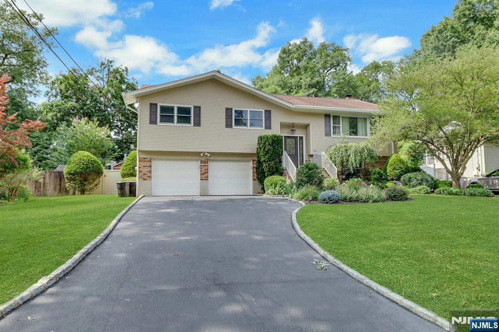 Beautiful 4-BR Move-In Ready Home with an Oasis Backyard in Westwood! Located in the sought-after Goodwin Park neighborhood, this exceptional home offers the perfect blend of space, comfort, and convenienceâ€”just steps from vibrant downtown Westwood. Step inside to a spacious living room that flows seamlessly into the dining room, creating an inviting layout for everyday living and entertaining. The gourmet kitchen features rich cherrywood cabinetry, granite countertops, high end stainless appliances, and a peninsula/breakfast bar, open to the spacious great room with a vaulted ceiling, skylights, a wall of windows, and French doors to the backyard. The primary suite offers dual closets and a beautifully updated full bath. Two additional generously sized bedrooms and an updated full bath with a double vanity complete the main level. The walk-out lower level features an expansive family room with a custom stone fireplace and French doors leading to a bright all-season sunroomâ€”the perfect place to relax and unwind. A spacious fourth bedroom, half bath, and laundry room complete this level. Outside, enjoy your own private oasis! The professionally landscaped property offers a fenced-in backyard with a large deck, covered patio and a heated saltwater in-ground pool, creating the ideal setting for summer entertaining, family gatherings, or simply unwinding at home. Close to town, restaurants, shopping, parks and schools!