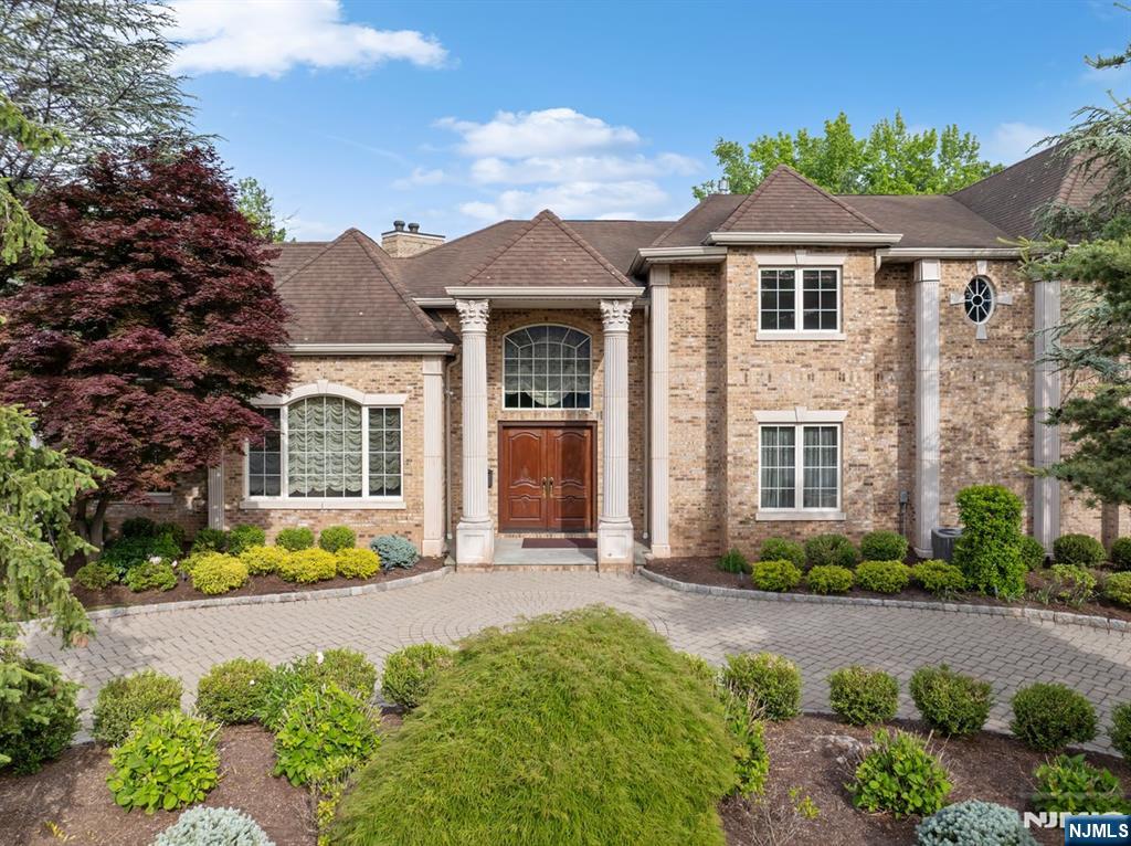 Welcome to one of the most exquisite residences in the coveted North Cliffs, ideally situated on one of the areaâ€™s most prestigious streets. This custom-built 5-bedroom, 6 full and 1 half bath estate showcases exceptional craftsmanship and timeless elegance throughout.A grand marble entry foyer sets the tone, flanked by a sophisticated formal living room and a banquet-sized dining roomâ€”perfect for both intimate gatherings and large-scale entertaining. Rich custom woodwork and intricate coffered ceilings, all crafted by master artisans, elevate every space.The heart of the home is a breathtaking great room featuring soaring floor-to-ceiling windows, a fireplace, and abundant natural light, seamlessly connecting to the outdoor oasisâ€”complete with a pool, patio, and fully equipped outdoor kitchen.The chefâ€™s kitchen, features radiant heated floors, premium finishes, and a spacious dining area, opening into a warm and inviting family room. Upstairs, the luxurious primary suite offers a serene retreat with a stunning newly designed marble bath. Three additional en-suite bedrooms complete this level, providing comfort and privacy for all.The fully finished lower level is designed for ultimate entertaining, featuring a large movie theater with fireplace, an elegant lounge area with wet bar, and an additional bedroom with a full bathâ€”ideal for guests or extended living. Donâ€™t miss this opportunity!!