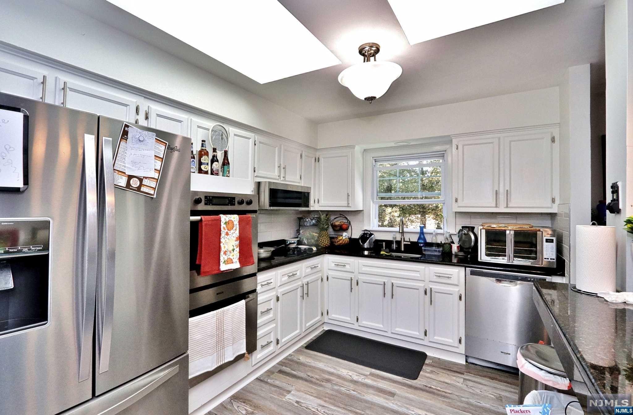 Prime location in the community of the desired Lake-Vu section. This home offers all the bells and whistles with quality craftsmanship. Enter into the foyer to then start on to the upper level where you find yourself welcomed by a large and inviting living room. Natural light hits every inch of this marvelous home and continue to walk into the dining room which flows perfectly from the recently updated kitchen. The kitchen features granite counters, island, stainless appliances and more. The 1st level has 3 bedrooms and one shared bath. The ground level has 1 bedroom and 1 bathroom, office space, family room with sliding glass doors to access the deck where you can enjoy those nice sunny days with an amazing view of a gorgeous backyard. You are ready to entertain for guests or just enjoy yourself here. This and so much more is waiting for you at your new home. Schedule a visit today!