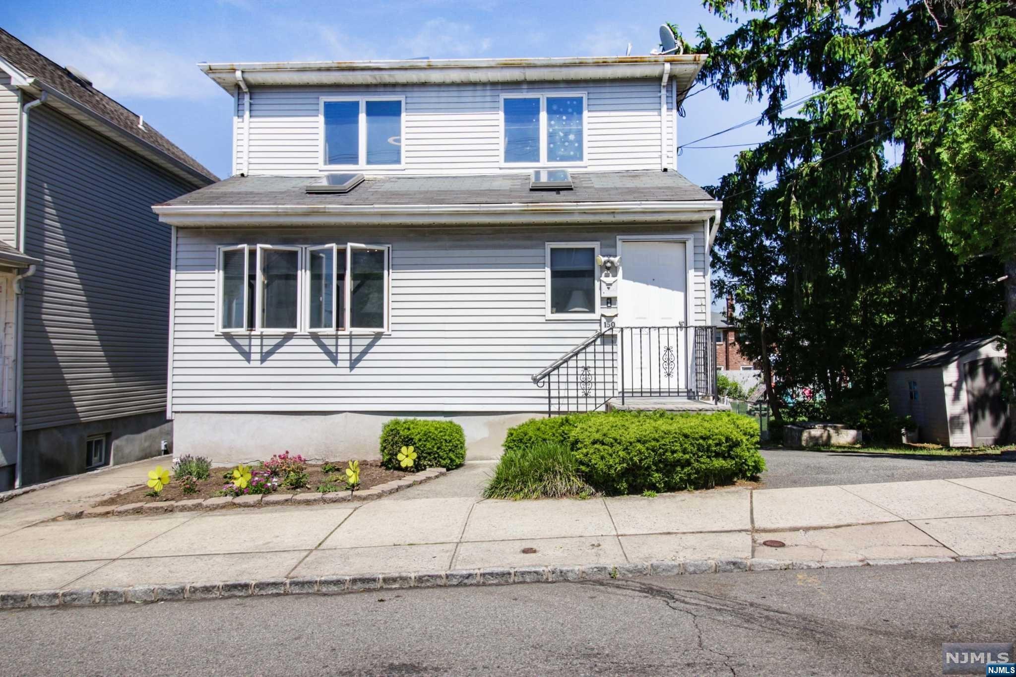 This Exceptional Two-Family Home Is Perfect For Investors Or Owner-Occupants Looking For Additional Rental Income! The Walkout Basement Offers Versatile Space, Suitable For An In-Law Suite, Home Office, Additional Storage, Or A Man Cave. Each Unit Is Equipped W/Their Own Lndry Areas, Complete W/Washers And Dryers & Separate Utilities. A Spacious Deck On The 1st Fl Overlook The Yard. The Large Backyard Offers A Fenced-In Area, A Patio, & Ample Space For Outdoor Activities. Additional Amenities Include A 2-Car Garage W/Electric, Off-Street Parking For Up To Four Cars, Outdoor Lighting & Two Storage Sheds. Currently, The First Floor Is Owner-Occupied, W/Potential Rental Income Estimated Btwn $2,800 & $3,200 Per Month. The Second Floor Is Rented At $2,000 Per Month, And The Garage Generates An Additional $425 Per Month. Conveniently located close to major highways, public transportation, shopping centers, schools, & parks. Address is also known as 150 Jackson Ave.