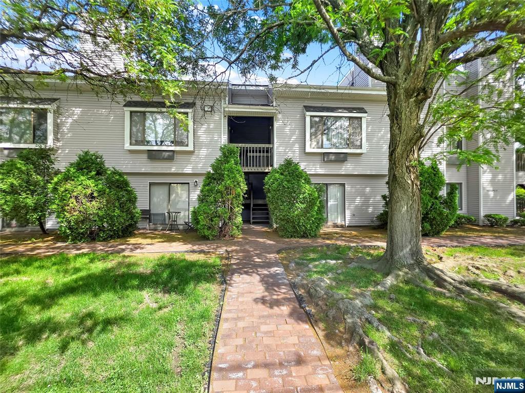 Tastefully renovated ground-floor, two-level condominium located at 90 Ralph St Unit #3 in a quiet area of Belleville. The entryway includes a floor-to-ceiling shoe closet and an adjacent coat closet. The main level offers a living room with a wood-burning fireplace, a dining area, a kitchen featuring solid wood cabinetry, quartz countertops, stainless steel appliances, and two pantry closets. Double sliding doors provide access to a private patio. The second level includes a linen closet, in-unit washer and dryer, two bedrooms, and two full bathrooms with custom tiled bath/shower. The primary bedroom includes a walk-in closet, large window with deep windowsill, and an en-suite full bathroom. The unit comes with a garage and one additional assigned parking space. Located near public transportation and major highways, with access to New York City. Proximity to local parks, shopping, and community amenities.