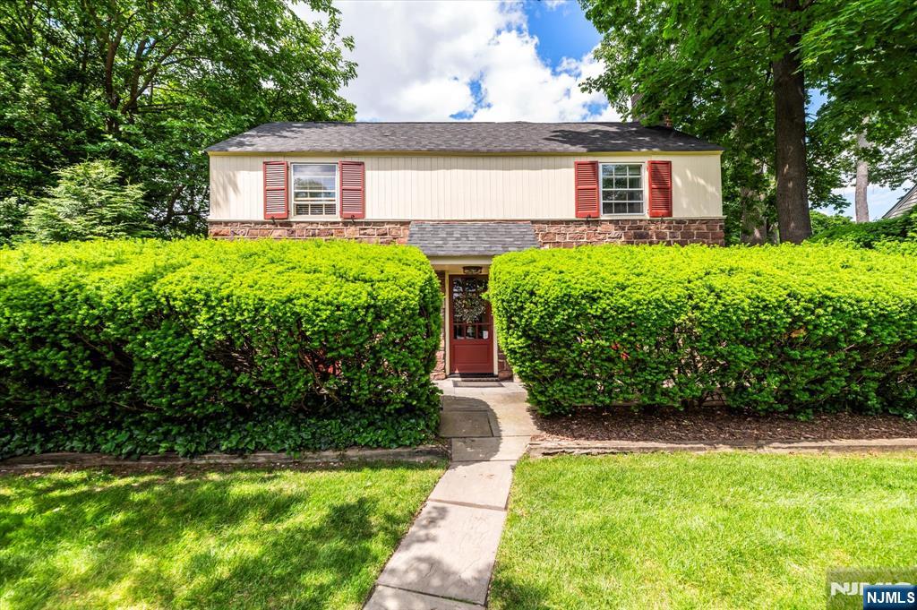 Welcome to this expanded stone-faced Colonial in Desirable Teaneck. Tucked away in Teaneckâ€™s famed Fred T. Warner Historic District, this spacious 4 Bedroom/2.5 Bath provides the perfect place to call home. First floor boasts a large living room w/ fire place, a combined dining/ eat-in kitchen combo-great for entertaining, a .5 bath PLUS a HUGE multi-purpose Room equipped with beamed ceilings, lotâ€™s of windows, closets & access to a secluded, fenced-in yard. 2nd Floor offers 3 additional bedrooms plus a massive primary suite with soaring ceilings, dressing room, walk-in closets, full bath, convertible room/walk-in closet - bright airy atmosphere . Hardwood floors throughout. Hidden 4 car driveway. House Generator & Sprinkler System. Country-like setting makes the yard perfect for BBQâ€™s, entertaining or just relaxing. Basement is full & ready to be finished for additional multi-purpose space or storage. All of this and more just steps away from NYC Buses, Major Highways, Parks, Cedar Lane shopping, FDU University and Major Malls. Start making memories in this truly lovely home!