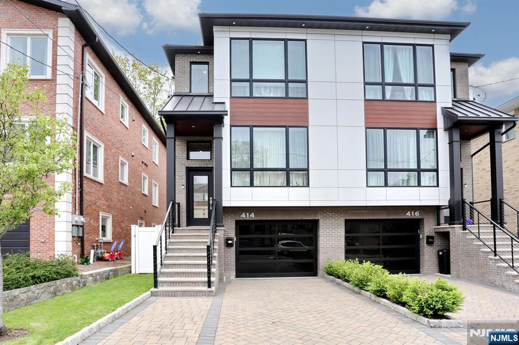Commuters Dream! You will love this 5-year young half duplex unit in desirable Cliffside Park. Just minutes from the GWB, Lincoln Tunnel and Ferry. Including all convenient shopping and dining on the water. This 3-level unit features 2212sf (tax record) 3 bedrooms and 4 bathrooms (3 full), 1.5 car attached garage with epoxy coated floor leading to a finished rec room, full bath, coffee bar, and SGD to the patio and fenced yard. Gorgeous driveway landscape lighting. Inground sprinklers. The Main level offers high coffered ceiling, living room with gas fireplace, dining room, convenient powder room, gourmet kitchen with Bertazzoni SS appliances, quartz countertops, coffee bar, SGD to TREX deck overlooking the fenced yard. Upstairs is the Master BR suite, 2 more generous BRs, laundry, and hall full bath. Convenient to everything! Don't miss this one!