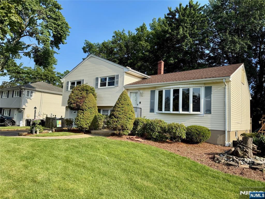 Sun-Lit & Spacious Split Level style home, beautifully maintained and ideally located in one of New Milfordâ€™s most desirable residential neighborhoods. The main level features a bright and airy living room with a large bay window, seamlessly flowing into a formal dining room and an adjacent eat-in kitchenâ€”perfect for entertaining and everyday living. The ground level offers a comfortable family room, convenient powder room, access to the attached garage, and sliding doors to sundeck and fully fenced in backyardâ€”ideal for summer gatherings, family, pets or relaxation. Upstairs, you'll find three generously sized bedrooms and two beautifully renovated full baths. Additional highlights include hardwood floors, central air conditioning, underground sprinklers and a finished basement. Donâ€™t miss the opportunity to call this special home your own!