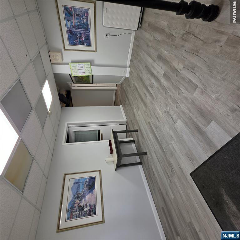 Well-appointed office condo offering a functional and professional layout across 2,400 SF. Features four private offices plus a separate executive suite with its own waiting area, storage closet, and private side entrance; ideal for a principal, senior partner, or separate practice. Two full bathrooms, a dedicated conference room, and a kitchenette round out the space. Central heating and cooling throughout. Turn-key ready for owner-occupants or investors.