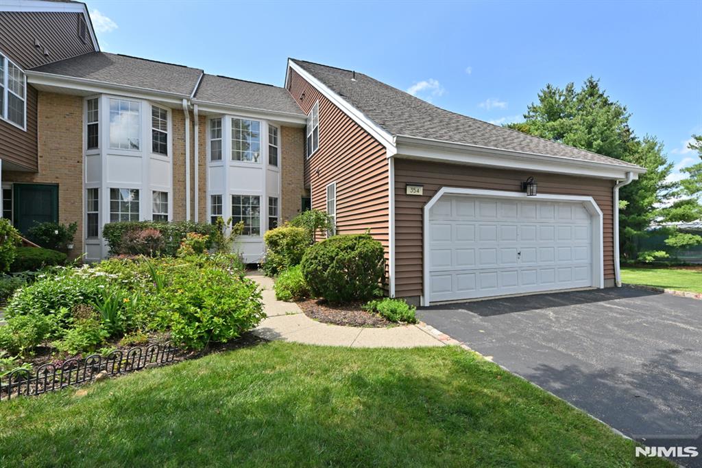 Welcome to the highly sought-after Gated Community of Eagle Ridge. This spacious end unit townhouse boasts 3 bedrooms and 2.5 bathrooms, complemented by a walk-out basement and an attached 2 car garage. The first floor features an eat-in kitchen with a dining area, a generously sized dining room, and a formal living room. The family room includes a fireplace, a wet bar, and sliding doors that open to a private deck, enhancing your outdoor living experience. As an end unit, this townhouse benefits from an abundance of natural light. Additionally, the first floor includes a half bath and a laundry room, along with the convenience of the attached 2 car garage. The second floor features a spacious primary bedroom complete with two walk-in closets, as well as a full bathroom equipped with both a tub and a separate shower. Additionally, there are two more bedrooms and a second full bathroom. The unfinished basement is spacious and includes a walk-out, awaiting your personal touches. With high ceilings, it provides ample room for customization. The complex is truly unparalleled, featuring both indoor and outdoor pools, a children's playground, tennis courts, pickleball courts, and a racquetball court. Additionally, it boasts a fitness center equipped with a weight room and a cardio area, as well as a studio designed for Zumba or Pilates classes. The clubhouse also has a large meeting area and much more! Desirable location for commuters and close to dining, shopping and highways.